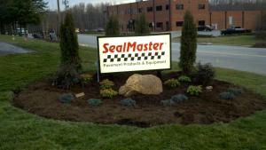The landscapers certainly made the job look easy! This is a tasteful arrangement and design surrounding the front lawn sign.